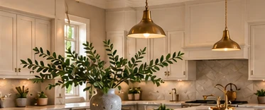 Inviting cream kitchen with greenery and warm natural lighting